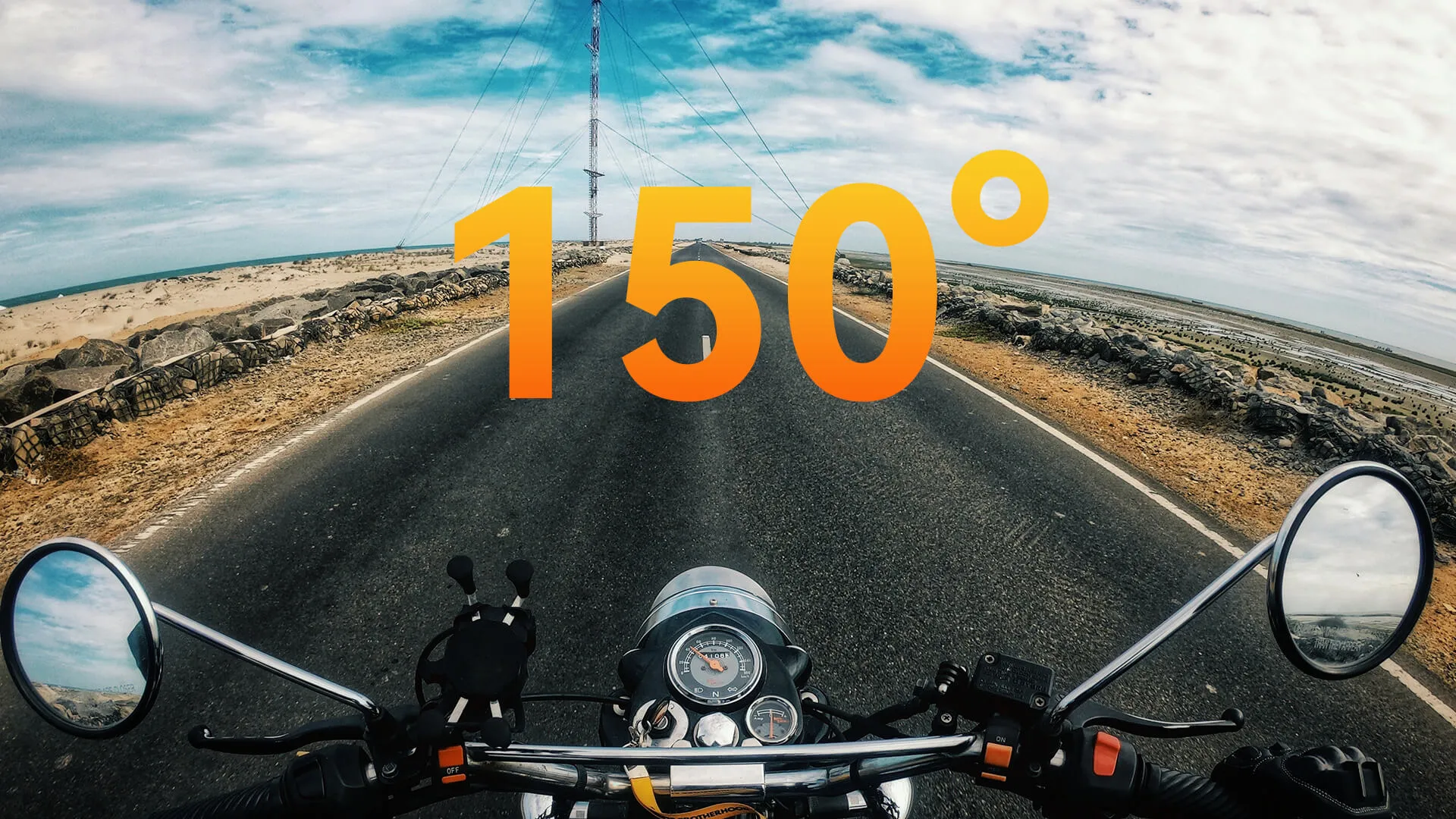 First-person view of a motorcycle ride along a coastal road, showcasing the Ranger Riding Camera 150° wide-angle lens.